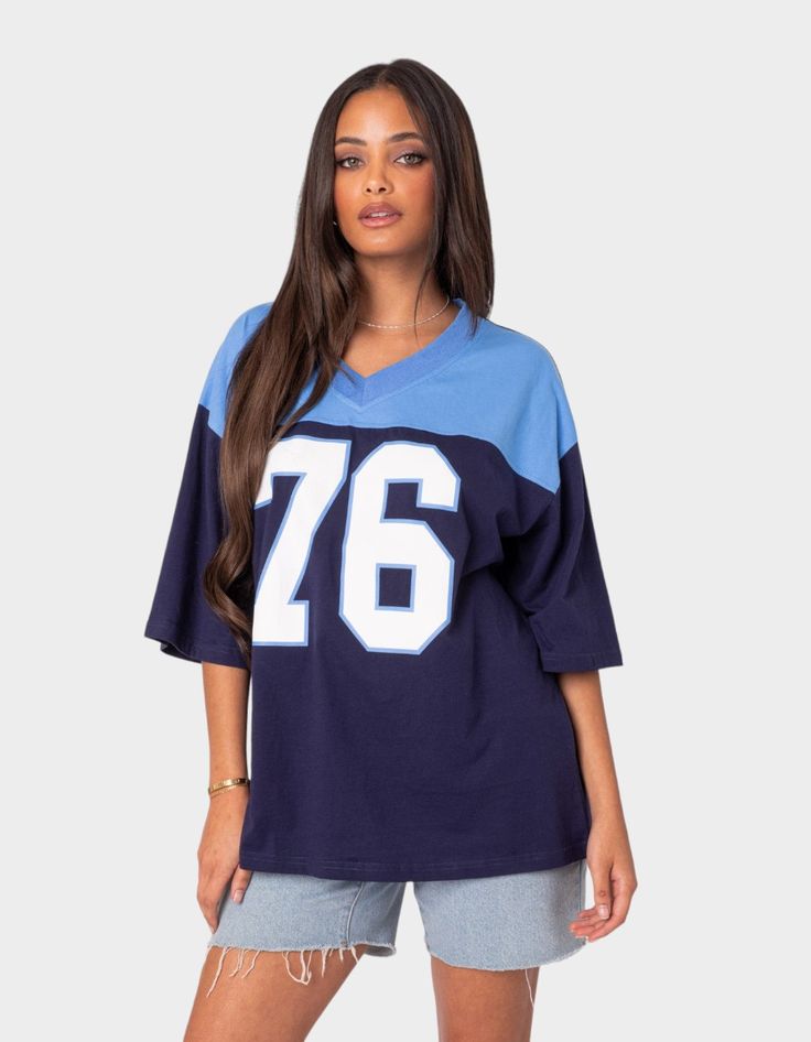 The Perfect Combination Of Comfy And Cool, This Oversized V-Neck Tee Will Have You Looking Sporty And Chic Wherever You Go. T-Shirt. Oversized Fit. Graphic Text. V-Neck. 100% Cotton. Model Wears Size S. Model Height Is 5'7. Item Care: Wash With Similar Color. | Edikted 76 Oversized Tee Football Girl, Oversized Jersey, Short Sleeve Tops Casual, Tops For Women Casual, Grunge Streetwear, Jersey Outfit, Streetwear Aesthetic, Casual Tops For Women, Oversized T Shirt