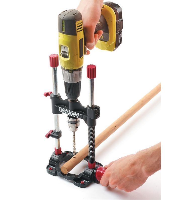 a person is using a driller to fix a screwdriver