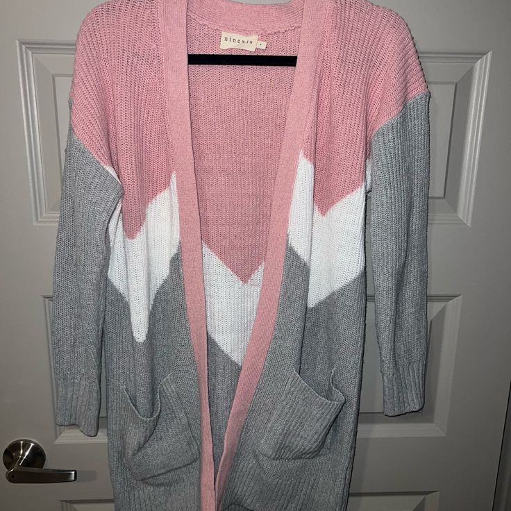 White, Pink, Grey Cardigan. Never Worn. Still Has Tag On It. Cozy Pink V-neck Outerwear, Pink Knit Cardigan For Layering, Pink Knit Cardigan For Casual Wear, Pink V-neck Trendy Outerwear, Cute Pink V-neck Outerwear, Trendy Pink Sweater For Layering, Pink V-neck Cardigan For Layering, Pink Casual V-neck Cardigan, Cozy Pink Cardigan For Layering