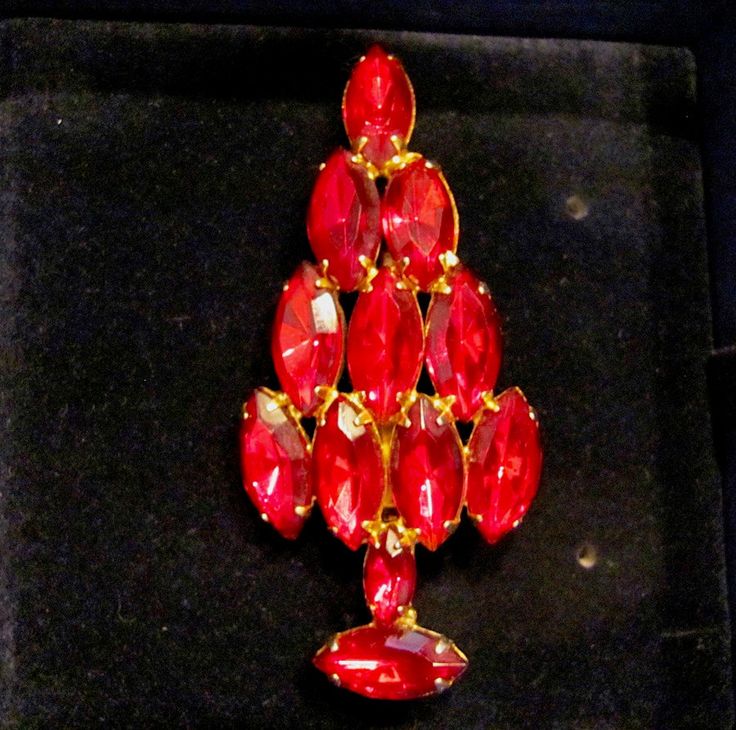 "SALE Vintage ATTRUIA Style Red Marquise Rhinestone Christmas Holiday Brooch Pin In Gold Tone Faceted Swarovski Crystal Vintage Collectible Pins Retro High End Quality Made Un-Signed ATTRUIA Red Marquise Rhinestone Christmas Tree Pin From the 60's. Picture #5 shows an Attruia Book Piece Pin. This pin is not a reproduction, it is a collectible retro brooch from the 60's. The brooch came to me in a velvet lines SWAROVSKI box, which will be included with the sale of the pin. This pin features eleve Holiday Wedding Jewelry Brooch, Red Rhinestone Brooches For Wedding, Holiday Formal Jewelry Brooch, Holiday Formal Brooch Jewelry, Red Rhinestone Wedding Brooches, Formal Holiday Brooch Jewelry, Red Formal Costume Jewelry Brooches, Formal Christmas Brooch Jewelry, Formal Red Rhinestone Brooch