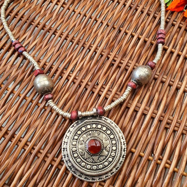 "Ethnic necklace,carnelian pendant,tribal jewelry,Afghan necklace,boho necklace,bead necklace, handmade jewelry,unique gift,aqeeq,gift Size:18\" This beautiful pendant necklace is inspired by kuchi jewelry. The necklace features vintage carnelian pendant and brass beads. The necklace looks amazing. ❀  Your order will be shipped in 1-2 business days. I DO COMBINE POSTAGE: *if you purchase 2 items you will be charged for one item.  *if you buy 3 items you will be charged for 2 items. * if you buy more then 3 items you will only be charged for 2 * once you place your order I will be sending you the remaining payment automatically to your account. ► Giving this as a gift? Don't worry, it comes in beautiful packaging, and ready for gift giving! If you would also like to include a small message, Bohemian Silver Carnelian Necklaces, Handmade Bohemian Carnelian Beaded Necklaces, Silver Carnelian Bohemian Necklaces, Silver Carnelian Bohemian Necklace, Bohemian Silver Beaded Necklaces With Carnelian, Traditional Handmade Carnelian Necklace, Traditional Silver Carnelian Necklace, Traditional Carnelian Necklace For Gift, Kuchi Jewelry