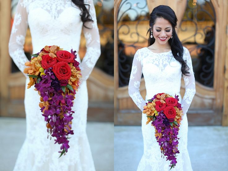 two beautiful women in wedding dresses holding bouquets