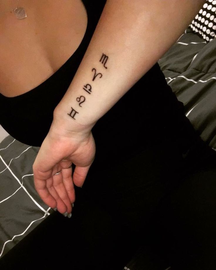 a woman's arm with the word march tattooed on it