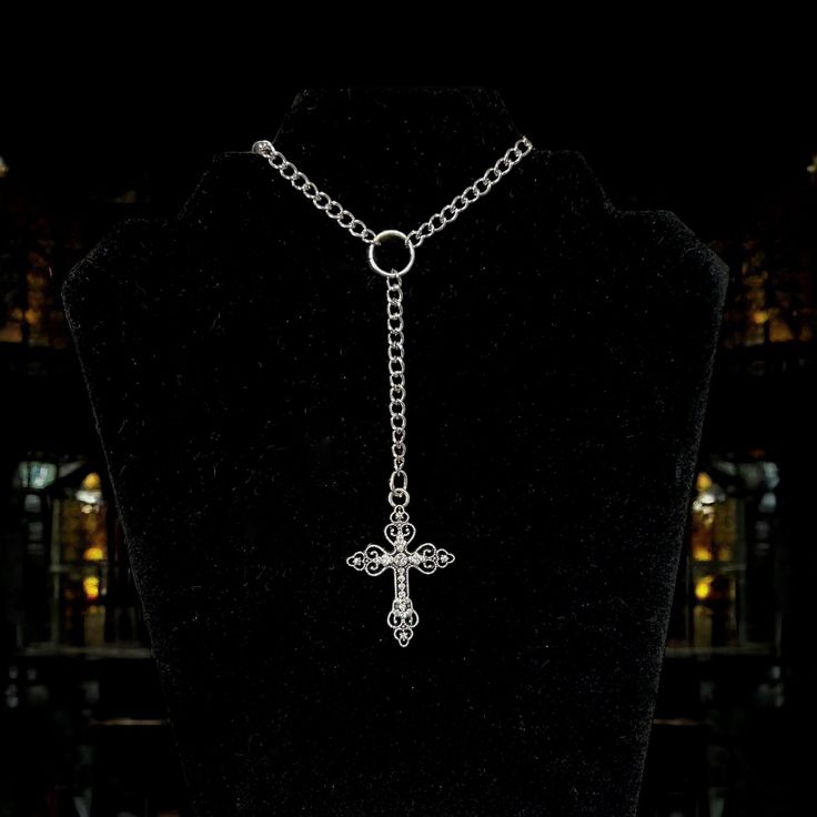 Forgive me father 🖤 This rosary inspired necklace features a curb style chain and a silver toned gothic style cross pendant with rhinestones.  Choose desired length when ordering. You can control whether you want to to fit tight or hang loose. Please take the time to measure your neck to ensure your satisfaction. Regardless of size chosen, there will be extra clasp rings attached to add a little more adjustable length.  Silver toned metals (silver plated chain) Lobster clasp closure  Handmade with love 🖤 Silver Cross Jewelry For Halloween, Punk Style Cross Necklace With Chain, Punk Style Clavicle Chain Necklace With Cross, Punk Style Silver Cross Pendant Jewelry, Punk Style Cross Clavicle Chain Necklace, Gothic Cross Pendant Clavicle Chain Necklace, Silver Cross Pendant Jewelry For Halloween, Gothic Clavicle Chain Necklace With Cross Pendant, Punk Cross Jewelry For Halloween