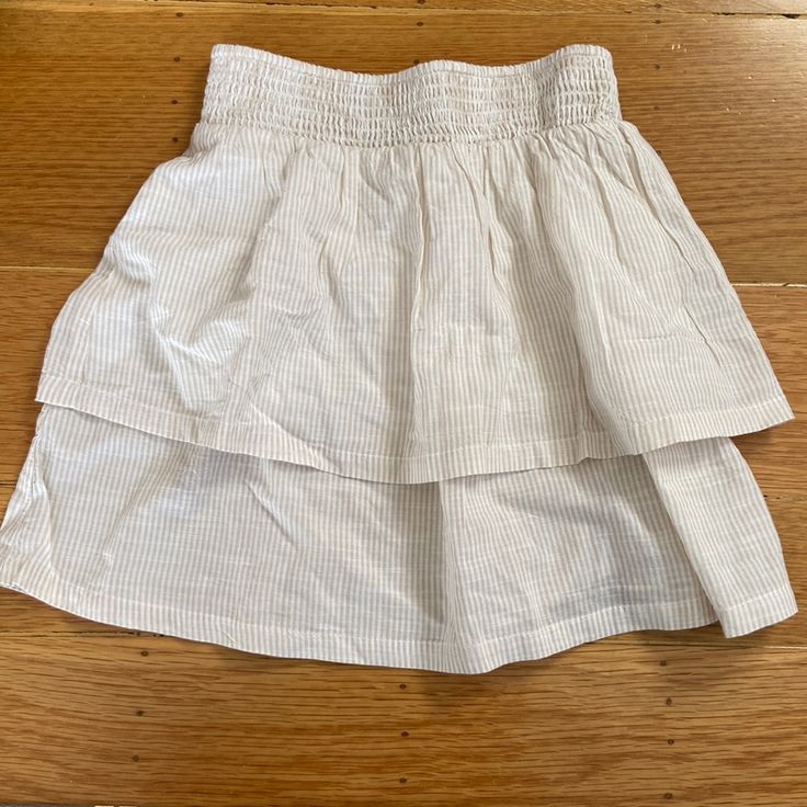 White And Beige Striped Light Weight Tiered Skirt. New With Tags. The Top Tier Is Lined (See Third Picture) But Is Still Somewhat Sheer. No Trades. White Skirted Bottoms For Spring, White Tiered Lined Skirt, White Mini Skirt With Elastic Waistband For Daywear, White Cotton Tiered Skort, White Tiered Skort With Elastic Waistband, White Tiered Skort For Spring, Casual White Tiered Skirt, White Lined Skirt For Day Out, Casual White Mini Skirt For Daywear