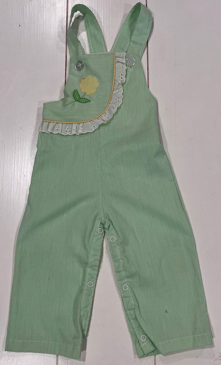 "Good clean condition - no issues,green petite striped with white eyelet trim. Snap crotch for easy changing no issues / smoke-free environment / labeled 18 months measures inseam 81/2\" length (top of shoulder straps to bottom leg) 26\"/ Elastic back waist 9\"-10\"/ clean - made in USA -smoke-free environment - this did not photograph as well as I hoped (207)" Playful Green Cotton Jumpsuits And Rompers, Green Spring Playtime Jumpsuits And Rompers, Cute Green Cotton Jumpsuits And Rompers, Cute Green Jumpsuits And Rompers For Spring, Cute Bib Front Shortalls For Spring, Cute Spring Shortalls With Bib Front, Spring Playtime Overalls, Spring Cute Bib Front Overalls, Spring Sleeveless Overalls For Playtime