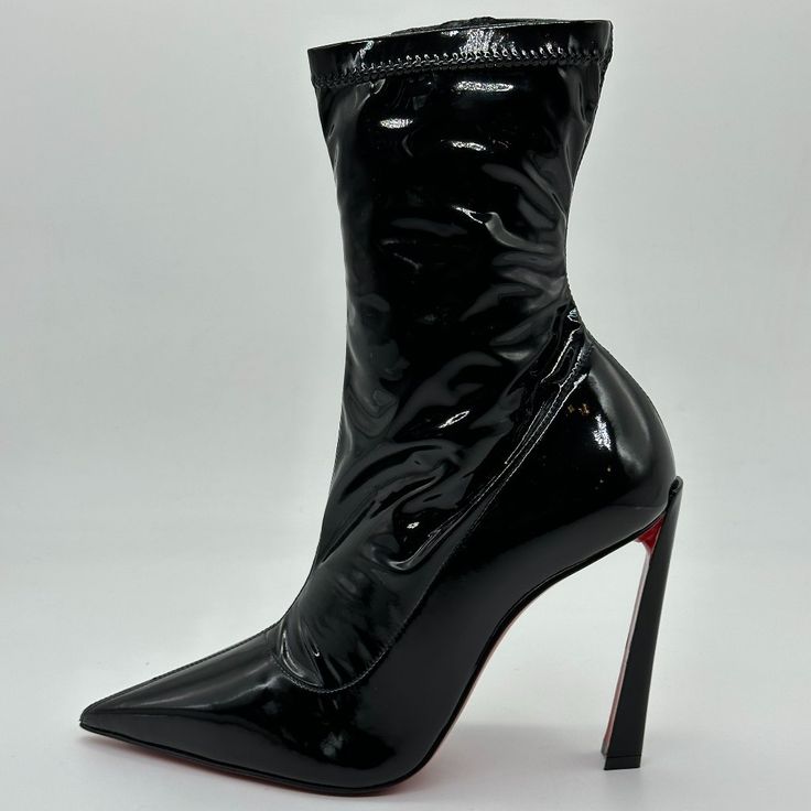 The Condora Sretch 100 Ankle Boots From Christian Louboutin Are Set Atop A Brand's New Plume Heel. Made From A Combo Of Patent Calfskin And Faux Leather In A High-Shine Finish, This Black Pair Features Piercingly Sharp Toes. Closure: Hidden Zipped Fastening Lining: Leather Sole: Leather Insole, Signature Red Leather Sole Toe Shape: Pointed Toe Upper: Fabric Made In Italy Shaft: 7" Tall. Size: 36 Eu (Heel: 4"). Typically Cl Shoes Run Small. Brand New In The Original Louboutin Box With Louboutin S Fitted High Heel Patent Leather Boots, Fitted Patent Leather Boots For Night Out, High Ankle Heels With Sculpted Heel For Evening, Modern High Ankle Heels For Party, Sleek Fitted High Heel Boots, Modern Fitted High Heeled Boots, High Ankle Fitted Patent Leather Heeled Boots, Fitted High Ankle Patent Leather Heeled Boots, Fitted Patent Leather Heeled Boots For Night Out