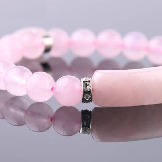 Rose Quartz Bracelet, Alloy Charm Bracelet,Love Bracelet, Women Jewelry, unconditional love bracelet.  Rose Quartz is the love stone! Adds positive love energy to relationships. Compassion and forgiveness. Calming, helps clear stored anger, resentment, jealousy, fears. Replaces negativity with harmony. Helps to balance upper four chakras and eases sexual/emotional imbalances. Enhances self-confidence and creativity. Aids kidneys and circulatory system, promotes release of impurities. The rose quartz crystal can be worn as a bracelet or place a stone under your pillow at night.  Due to the nature of stone formations and our studio lighting, every gemstone product will vary slightly, in shape, size, color, pattern and will not be an exact replica of the one you see in photos. Merchandise enl Pink Crystal Bracelet, Rose Quartz Bracelet Beads, Bracelet Chakra, Bracelet Love, Nature Earrings, Rose Quartz Bracelet, Bracelet Crystal, Rose Quartz Beads, Love Bracelet