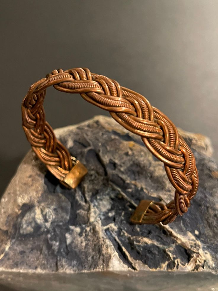 Intricate handmade pure copper healing cuff bracelet from Nepal with a beautiful braided design.Adjustable, wearable & interesting copper healing cuff bracelet. Copper helps maintain healthy bones, blood vessels, nerves, and immune function, and it contributes to iron absorption. Sufficient copper in the diet may help prevent cardiovascular disease and osteoporosis, too. Copper was the first metal ever used by humans. Middle Eastern artisans of the 5th & 6th millennia B.C fashioned this copper i Adjustable Copper Bohemian Braided Bracelet, Adjustable Copper Braided Bohemian Bracelet, Adjustable Bohemian Copper Braided Bracelet, Adjustable Brown Copper Braided Bracelets, Handmade Adjustable Bronze Braided Bracelets, Handmade Copper Braided Bangle Bracelet, Bohemian Brown Bracelet In Copper Wire, Bohemian Brown Copper Wire Bracelets, Traditional Adjustable Copper Cuff Bracelet