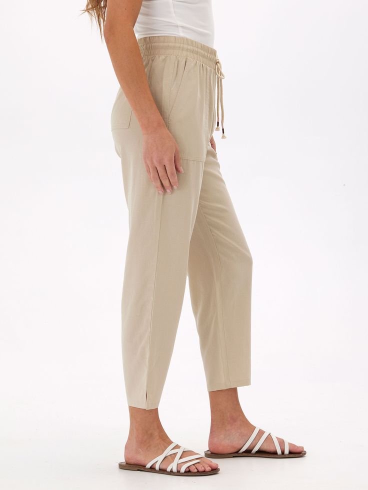 Made from a sustainable blend of Lyocell and Linen, the Winnie Woven Pant features a relaxed fit and elastic waistband. Versatile Relaxed Fit Viscose Bottoms, Relaxed Fit Viscose Bottoms, Casual Bottoms With Paperbag Waist, Spring Relaxed Fit Pants With Paperbag Waist, Spring Relaxed Fit Paperbag Waist Pants, Versatile Relaxed Fit Viscose Pants, Relaxed Fit Viscose Bottoms With Elastic Waistband, Casual Solid Viscose Bottoms, Effortless Beige Relaxed Fit Bottoms