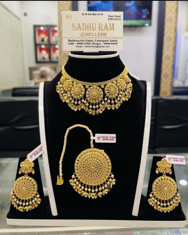 the necklace and earrings are on display for sale