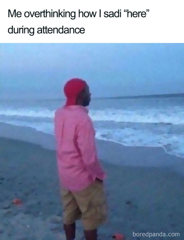 a man standing on top of a beach next to the ocean in front of an overcast sky