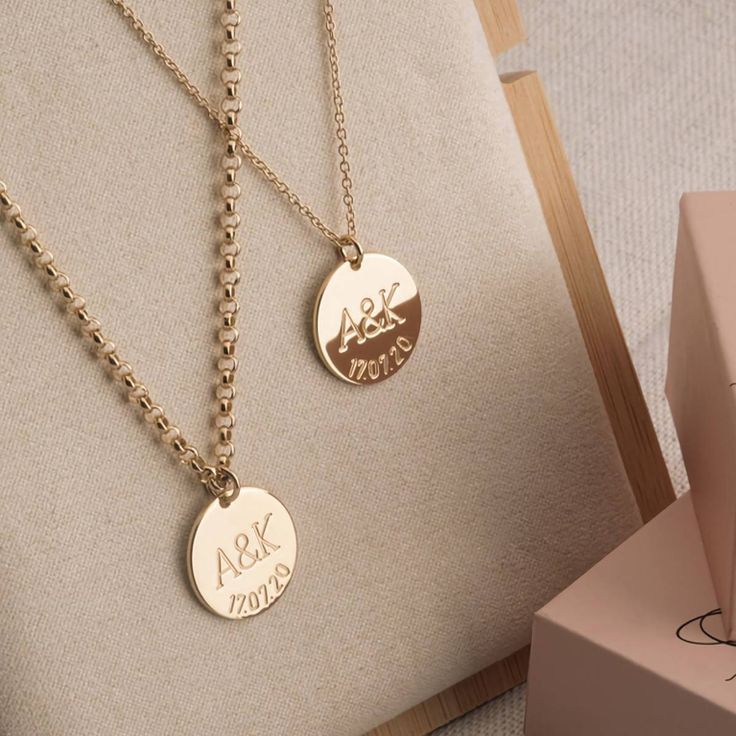 Personalized Couples Necklace Set with Initials and Anniversary Date Now you, or a loved one or special friend, can make a stylish and personal fashion statement with this elegant Personalized Couples Necklace Set with Initials and Anniversary Date. This exquisite personalized couples necklace set will make a very thoughtful gift for someone special, and will be greatly appreciated for years to come. The personalized couples necklace set includes two necklaces with round pendants featuring two i Elegant Customizable Necklace For Anniversary Gift, Elegant Customizable Necklace For Anniversary, Elegant Necklaces With Initials For Anniversary, Anniversary Jewelry With Initial Pendant Hallmarks, Anniversary Necklace With Initial Pendant And Hallmarks, Anniversary Necklace With Engraving Option, Elegant Jewelry For Anniversary Gift With Hallmarks, Elegant Necklace For Wedding Gift, Luxury Personalized Necklaces For Wedding