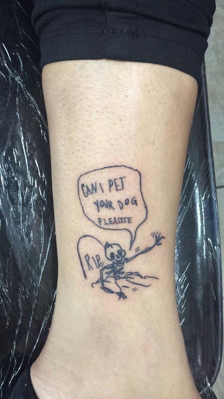 a person with a small tattoo on their foot that says, can't pet your dog please