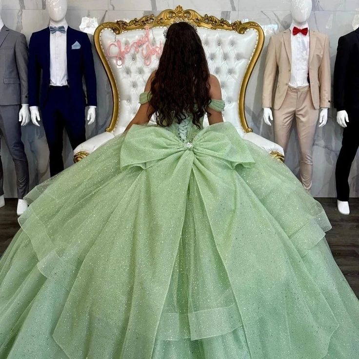 Step into a world of elegance with this Sage Green Off-Shoulder Corset Quinceanera Dress. The soft sage green hue and dreamy tulle fabric create a look that’s both modern and enchanting, perfect for making your quinceanera unforgettable. The off-the-shoulder neckline adds a touch of sophistication, while the sleeveless design keeps the look light and graceful. The beading details and charming bow-knot embellishment bring a sense of delicate artistry to the gown. The lace-up back provides a secur Sage Green Quinceanera Dresses, Sage Green Quinceanera, Green Quinceanera Dress, Formal Birthday Party, Corset Ball Gowns, Green Quinceanera, Green Quinceanera Dresses, Quinceanera Themes Dresses, Quinceñera Dresses