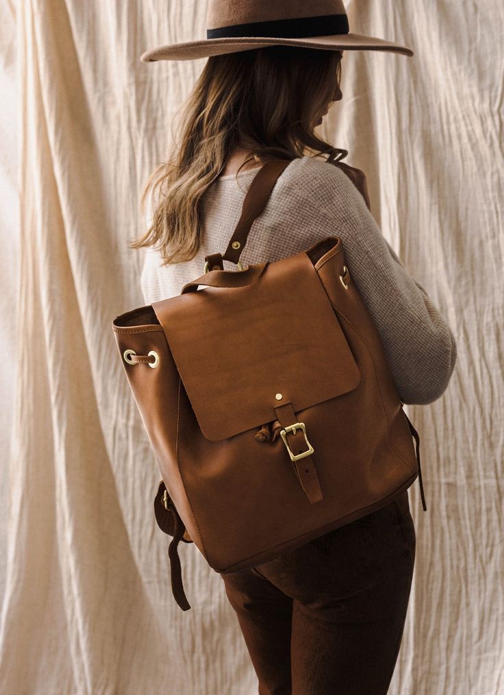 A leather backpack that's the perfect size for your everyday hustle. It can fit your laptop as well as whatever accessories you need from day to evening. This sturdy leather backpack is a robust companion that will stay with you for years. Add a monogram to let them know it's yours. Materials Features Dimensions 100% Full-Grain Leather Brass Hardware Leather Straps Copper Rivets Adjustable leather straps Internal zipper drop pocket Grab handle Length: 13" Width: 6" Height: 14" Weight: 3lbs. Classic Leather Satchel Backpack For Everyday, Classic Everyday Satchel Shaped As Backpack, Classic Leather Backpack For On-the-go, Modern Backpack With Leather Lining For Everyday, Modern Leather Backpack With Leather Lining For Everyday, Everyday Leather-lined Satchel Backpack, Classic Everyday Laptop Backpack, Everyday Satchel With Leather Lining And Backpack Shape, Leather Backpack Laptop Bag