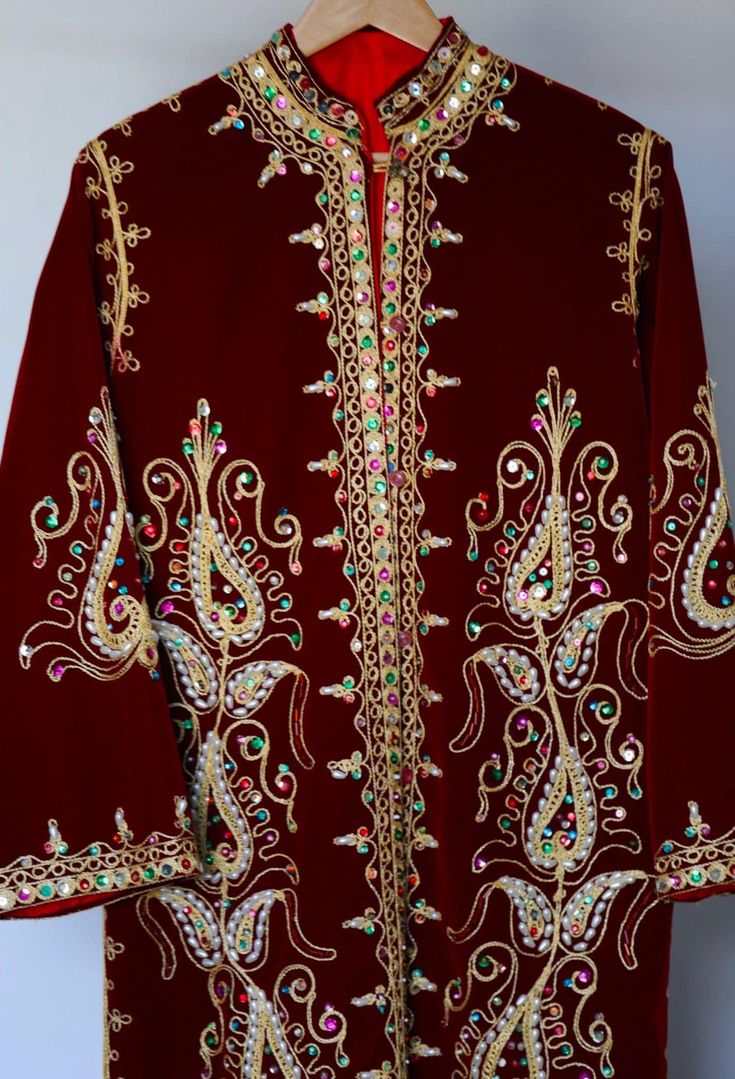 Eid Floor-length Kaftan With Traditional Patterns, Traditional Patterned Kaftan For Wedding And Transitional Seasons, Wedding Kaftan With Traditional Patterns, Embellished Dresses For Traditional Ceremonies And Festivals, Traditional Embellished Embroidered Festive Dress, Traditional Festive Embellished Embroidered Dress, Traditional Embellished Embroidered Dress With Drape, Festive Floor-length Kaftan With Traditional Patterns, Traditional Long Sleeve Embellished Dresses