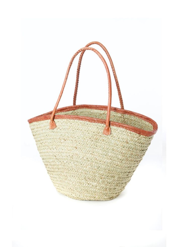 Kenyan artisans expertly weave thinner strips of palm leaves to create this stylish open top tote bag. This indispensable palm fiber tote offers a more refined weave than other palm shoppers. A leather trimmed top and handles add style and durability. A lovely handwoven fair trade basket from Africa, so darling that you and your little one may want to get matching baskets. Palm Leaf Beach Bag With Braided Handles For Shopping, Palm Leaf Basket Bag For Shopping, Palm Leaf Tote Straw Bag For Shopping, Natural Woven Leather Straw Bag For Shopping, Natural Fiber Straw Bag With Rolled Handles For Shopping, Shopping Straw Bag With Rolled Handles, Eco-friendly Woven Leather Basket Beach Bag, Woven Leather Beach Bag For Shopping, Eco-friendly Straw Bag With Leather Handles For Shopping