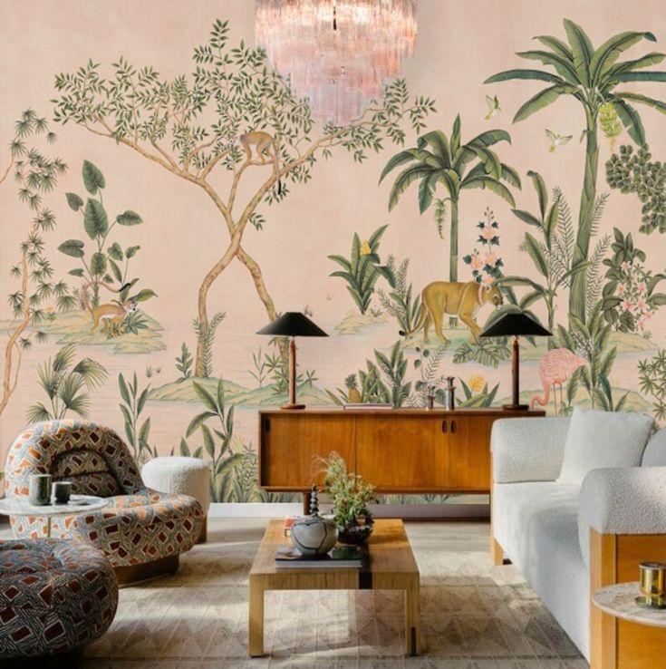 a living room filled with furniture next to a wall covered in jungle murals and palm trees