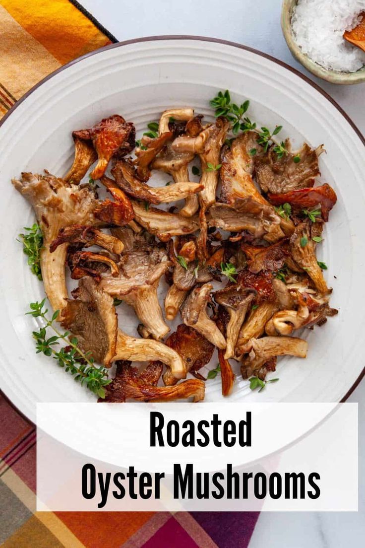 roasted oyster mushrooms on a white plate with parsley