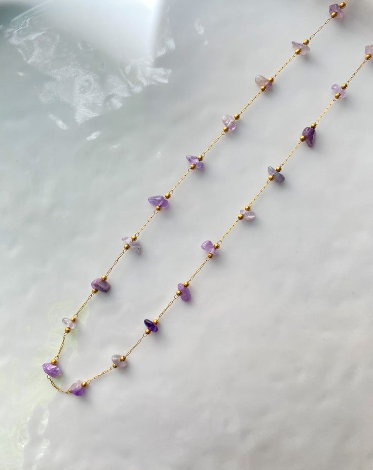 Beautiful string necklace handcrafted using the finest Amethyst agate stones. You can layer it up with any of our gold necklaces and style it your way. This necklace has adjustable length from 16 to 18 inches. Made with 18k gold plated brass metal. Adjustable Gold-plated Gemstone Necklace, Dainty Necklaces With Natural Stones For Layering, Dainty Natural Stone Choker Necklace, Adjustable Gemstone Choker Necklace, Dainty Adjustable Beaded Gemstone Necklaces, Adjustable Gold Charm Necklaces With Gemstone Beads, Adjustable Long Gemstone Necklace, Gold Agate Wire Wrapped Necklace, Gold Amethyst Jewelry With Adjustable Chain