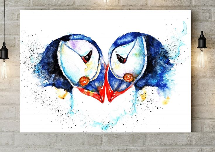 two blue birds with red beaks are facing each other in the shape of a heart