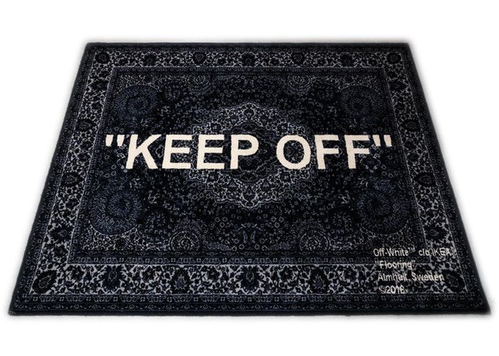 an area rug with the words keep off written on it in white letters and black background