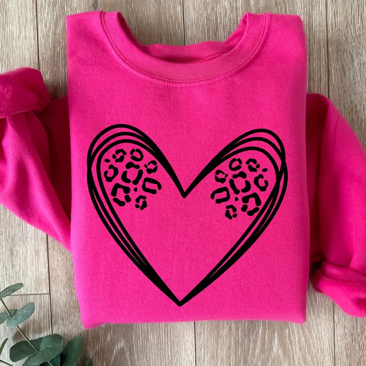 Leopard heart tee or crewneck is such a cute and simple design to make a big impact. Choose any color to make it pop.  Size up one for a baggier oversized fit. These shirts are made to order so you get exactly what you want. Join our fb group for specials: https://www.facebook.com/groups/708500593017136/?ref=share Oversized Heart Graphic T-shirt With Crew Neck, Oversized Heart Graphic Crew Neck T-shirt, Oversized Crew Neck T-shirt With Heart Graphic, Oversized Heart Graphic T-shirt For Streetwear, Trendy T-shirt With Heart Graphic For Everyday, Long Sleeve T-shirt With Heart Graphic For Streetwear, Casual Crew Neck T-shirt With Heart Patch, Pink Heart Graphic T-shirt For Streetwear, Oversized Heart Print Casual Tops