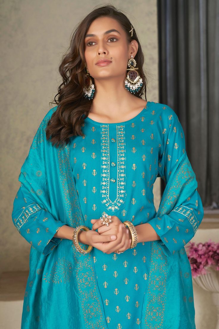 Add some ethnic charm to your festive look with our Awesome Rayon Fabric Readymade Salwar Suit. Made from premium quality rayon, the outfit is super comfortable and designed to give you the perfect fit. The salwar suit is in vibrant colors that adds a spark to your personality. It comes as a complete set with a beautifully crafted kurta, well-fitted salwar and an exquisite dupatta. Great choice for a glamorous festive wear, hurry up and add it to your cart today! Cyan Color, Cyan Colour, Festive Look, Festive Wear, Salwar Kameez Designs, Salwar Suit, Rayon Fabric, Salwar Suits, Festival Wear