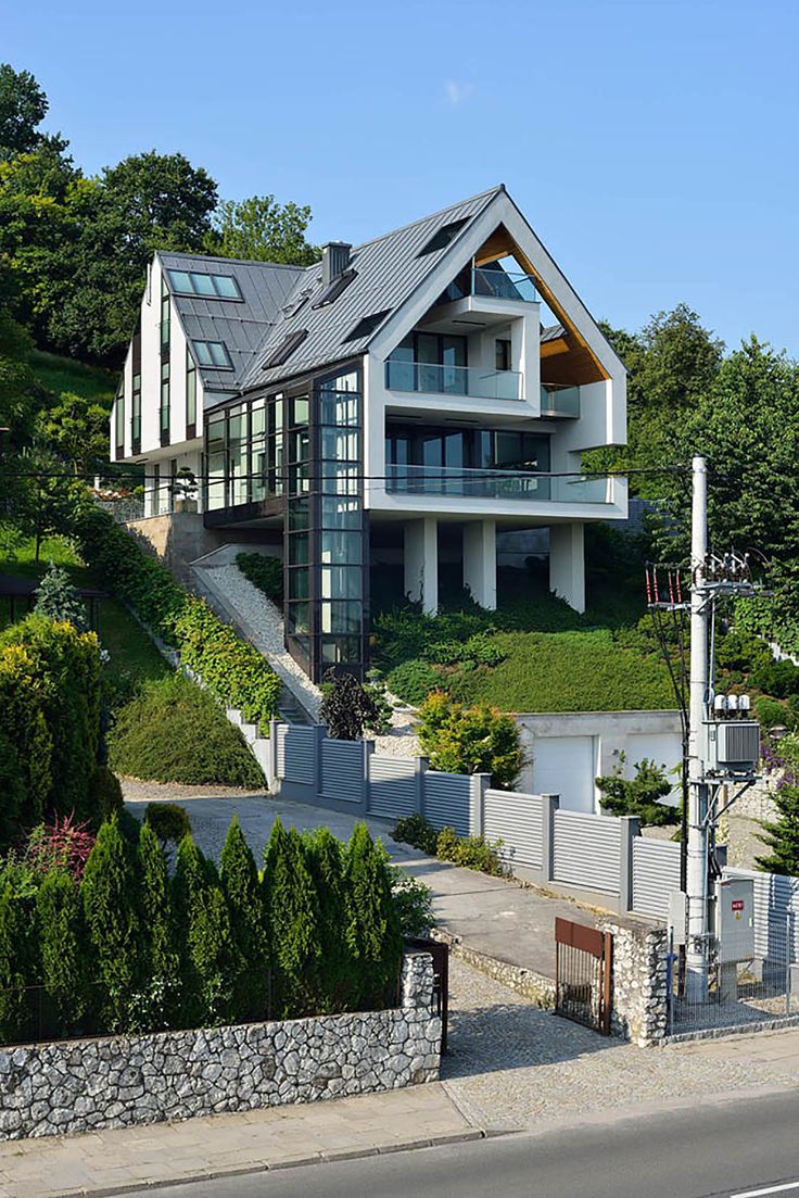 a large house on the side of a hill