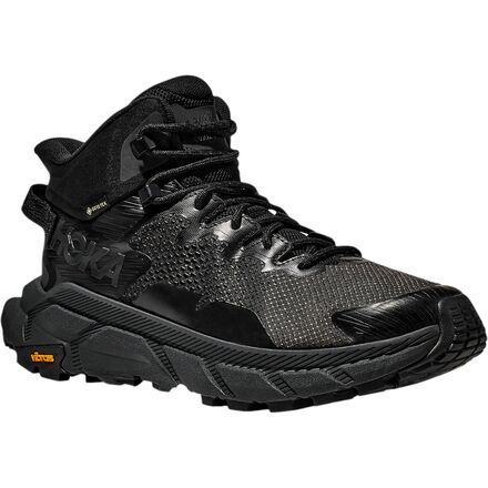 HOKA's newest hiking boot, the Trail Code GTX helps us tread more lightly on the trail and on the planet with its lightweight build and extensive use of recycled materials. The Trail Code is max cushioned like other HOKA hiking boots while having a more sneaker-like build than the Anacapa and using a new foam that's both responsive and super-cushy to both hold up to hiking and keep our hiking feet content. Weighing less than two pounds per pair, this light hiker doesn't slow us down, but it's Rugged Gore-tex Trail Running Shoes With Impact Resistance, Rugged Sports Hiking Boots, Rugged Impact-resistant Hiking Boots For Sports, Rugged Impact Resistant Hiking Boots For Sports, Impact Resistant Rugged Hiking Boots For Sports, Durable Rugged Hiking Boots For Trail Running, Impact-resistant Waterproof Boots For Trail Running, Impact Resistant Waterproof Boots For Trail Running, Durable Rugged Walking Shoes For Trail Running