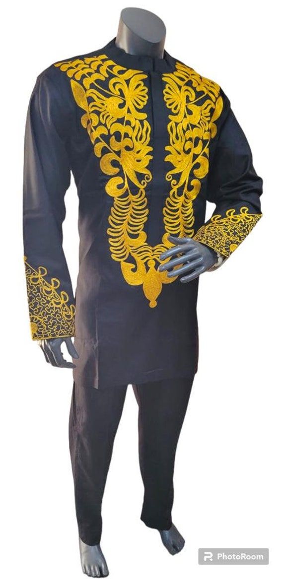 Traditional African Dashiki Shirt with Gold embroidery with long sleeves 100% Cotton Vibrant colors. Pullover Shirt Black hat not included Colors include - Black and Gold embroidery Available in Plus Size Size Measurements S  = 36 Inches chest around M = 42 Inches chest around L  = 47 Inches chest around XL= 52 Inches chest around 2X= 55 Inches chest around Long Sleeve Multicolor Embroidered Cotton Set, Multicolor Embroidered Cotton Long Sleeve Sets, Long Sleeve Cotton Sets With Multicolor Embroidery, Casual Long Sleeve Embroidered Kurta, Long Sleeve Kurta With Gold Embroidery For Eid, Eid Long Sleeve Kurta With Gold Embroidery, Gold Embroidered Long Sleeve Kurta For Eid, Casual Black Sets For Eid, Traditional Long Sleeve Set With Gold Embroidery