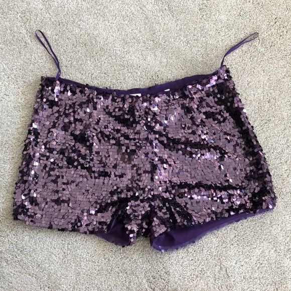 Shop sjh5100's closet or find the perfect look from millions of stylists. Fast shipping and buyer protection. Chic sequin shorts to dress up any outfit. Worn once, these look brand new. Purple Glitter Pants, Purple Surprise Dance Outfit, Sequin Hot Pants, Sparkle Shorts Outfit, Colorful Night Outfit, Purple Short Bottoms For Party, Purple Party Bottoms Short Length, Purple Short Length Bottoms For Party, Purple Party Shorts