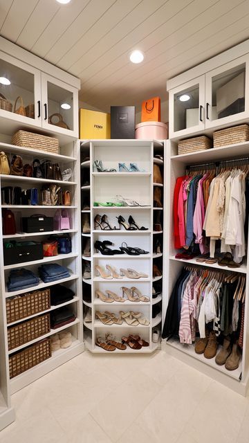 an organized closet with white shelving and lots of shoes