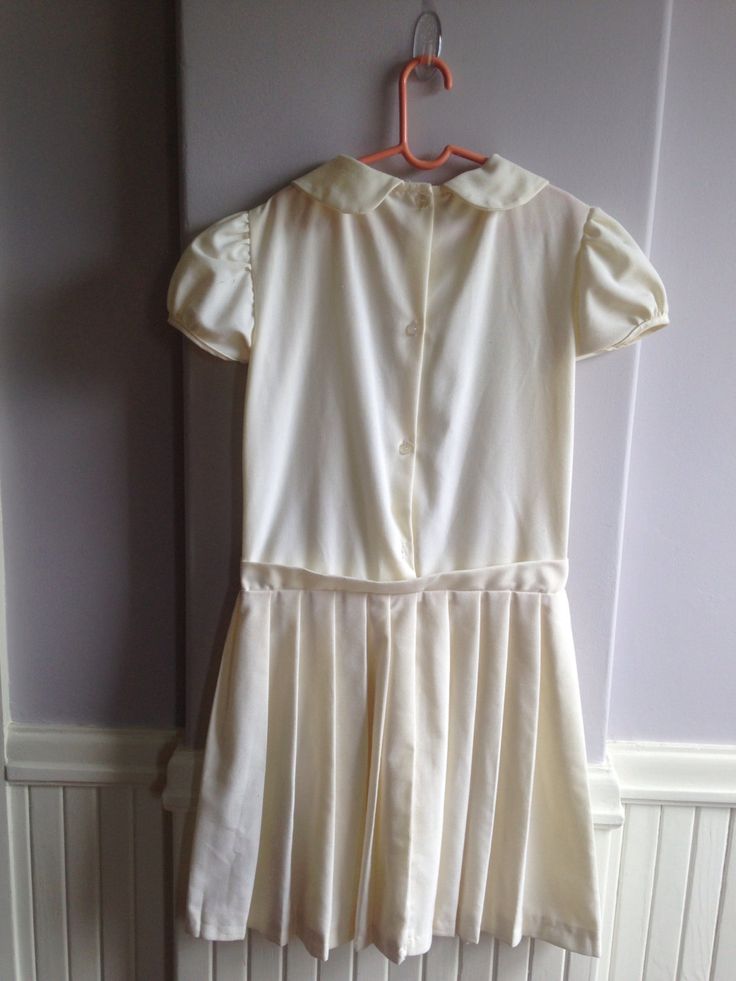 "Circa late 1960's early 1970's vintage dress for a young girl. Beautiful little dress, dropped waist Chemise style Marked a size 12. Measurements are; Armpit to armpit13\" Shoulder to shoulder14\" Waist13\" Length25\" Sleeves3\" Feel free to convo me with any further questions. Thank you for your interest." Spring School Dress With Peter Pan Collar, Pleated School Dress For Spring, Spring School Pleated Dress, Spring Pleated School Dress, Pleated School Dress For Summer, Pleated Summer School Dress, Summer School Pleated Dresses, Fitted Short Sleeve Dress For School, Summer School Uniform Dress With Short Sleeves