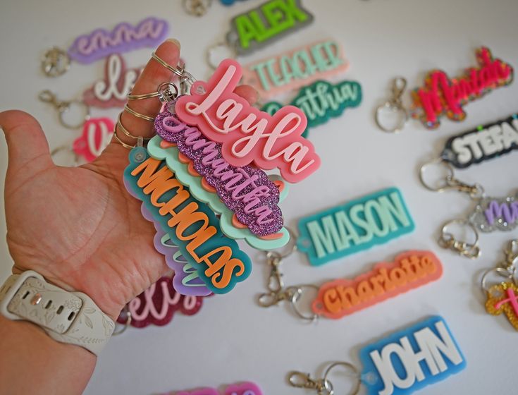 Decorate your bag or child's backpack with these fun personalized name tag keychains!  Choose your own color and font from the charts in the listing photos and make it your own!  These make great back to school items, gifts for teachers, party favors, or a "just because" gift! Glitter Stars style can be found here: https://www.etsy.com/listing/1680950008 Confetti Glitter Styles can be found here: https://www.etsy.com/listing/1499618022 Bulk orders for sports/dance/cheerleading teams and party fa Back To School Items, Name Keychains, Charm Party, Laser Cut Acrylic, Just Because Gifts, Glitter Stars, Gifts For Teachers, Bag Tag, Purse Charms