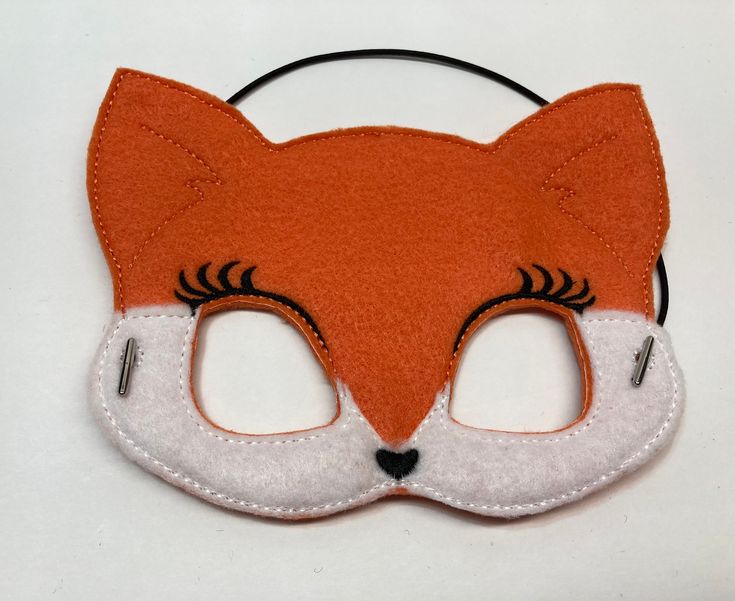 "Fox Masks. Great for dramatic play/dress-up. Fun mask for Halloween or Cos Play. These masks would make a fun party favor or fun addition to a themed birthday party. Need a larger quantity than what I have listed? Message me. I can usually accommodate larger orders. These masks are made from felt. The details are machine embroidered. The masks include a 13\" elastic strap. This size typically fits from age 3 to small adult. This mask measures approximately 7 by 5 inches. These items can be clea Cute Halloween Dress-up Costumes, Fun Red Costume Accessories For Party, Cute Halloween Costumes For Role Play, Fun Costume Accessories For Costume Party, Fun Party Masks For Carnival, Fun Carnival Party Masks, Fun Party Mask Costume Accessory, Themed Party Eye Mask Costume Accessory, Novelty Eye Mask For Costume Party