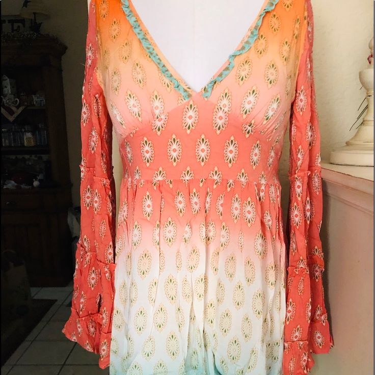 This Dress Is So Beautiful Guessed By Marciano V-Neck With Wide Bell Sleeves Very Beautiful Peachy Orange Colors. Can Be Dressed Up Or Down Zips In The Back Size Extra Small Offers Welcome:) Fitted V-neck Boho Dress With Boho Print, Multicolor V-neck Boho Dress For Spring, Fitted V-neck Mini Dress For Festival, V-neck Boho Dress For Festivals, Flowy V-neck Dress For Festival, Flowy V-neck Festival Dresses, Bohemian Fitted Mini Dress With Long Sleeves, Bohemian Fitted Long Sleeve Mini Dress, Fitted Long Sleeve Bohemian Mini Dress