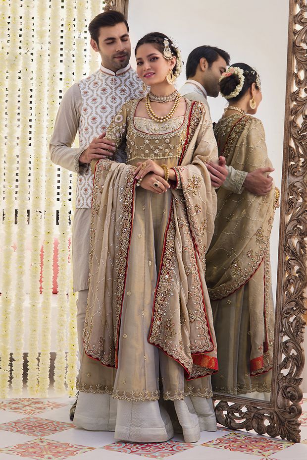 Wedding Sharara With Dabka Work And Traditional Drape, Wedding Anarkali Set With Intricate Embroidery In Jamawar, Traditional Dabka Dresses For Reception, Wedding Sharara With Dabka Work In Jamawar, Wedding Sharara With Dabka Work, Wedding Traditional Wear With Dabka Work In Raw Silk, Gold Chanderi Sherwani For Wedding, Festive Organza Lehenga With Naqshi Detailing, Traditional Raw Silk Wear With Dabka Work For Wedding