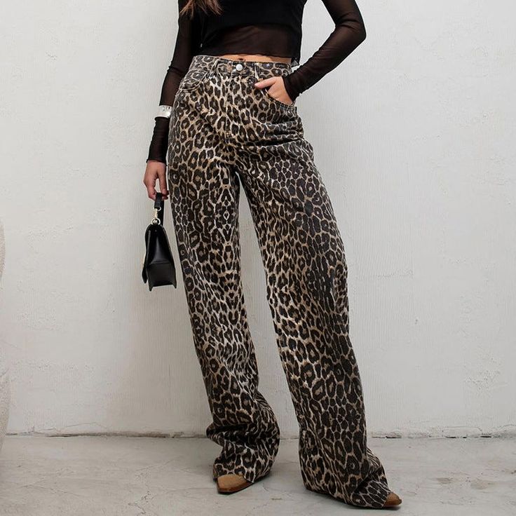 Introducing our trendy and bold high waist leopard print straight pants, perfect for those who love to make a statement with their streetwear style! These pants are made of 100% pure cotton, providing both comfort and breathability for all-day wear. Whether you're running errands or going to work, these pants are versatile enough to wear for any occasion. The straight leg cut provides a flattering silhouette, while the high waist design elongates your legs for a taller appearance. The leopard pr Leopard Trousers, Streetwear Mode, High Waist Fashion, Printed Trousers, Streetwear Style, Outfit Making, Women Shirts Blouse, Type Of Pants, Leopard Pattern