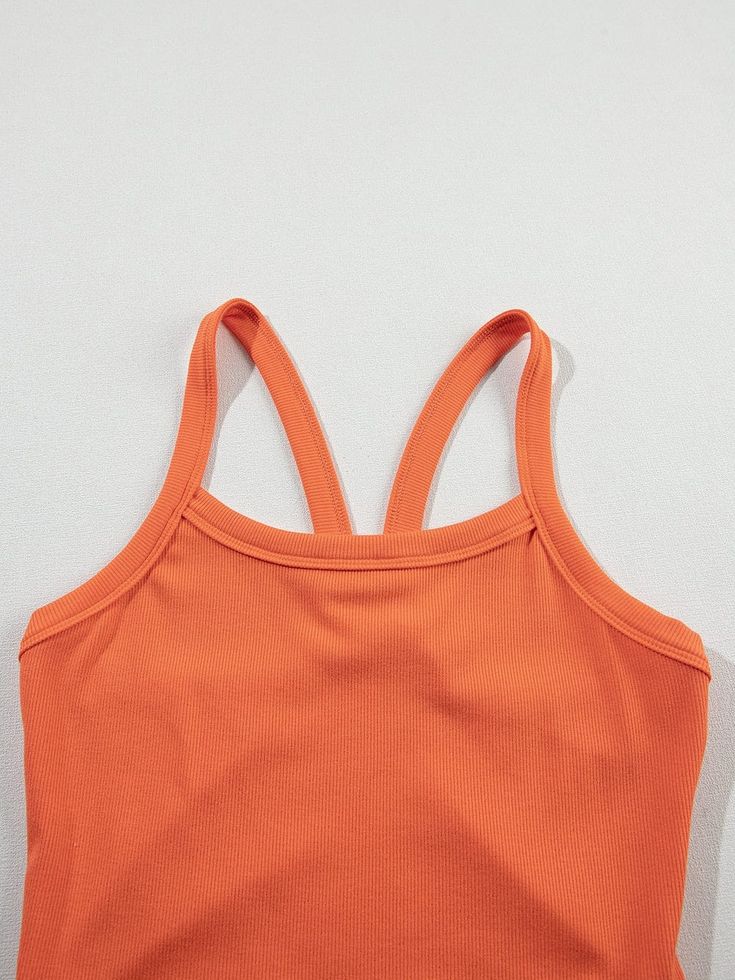 Grapefruit Orange Athletic Ribbed Cropped Cami Top Stay cool and stylish during workouts with this trendy Grapefruit Orange Athletic Ribbed Cropped Cami Top. Made of high-quality 93%Viscose+7%Elastane material, this top offers exceptional comfort and flexibility for unrestricted movement. Key Features: Material: 93%Viscose+7%Elastane Style: Casual, active Pattern: Solid Season: Summer Occasion: Daily, Outdoor Color: Grapefruit Orange Benefits: Exceptional comfort and flexibility Ribbed texture for a touch of sophistication Versatile piece for athletic activities and casual wear Pairs well with high waist pants to show off a sexy curve Ribbed Cotton Sports Tops, Sports Ribbed Cotton Tops, Cotton Ribbed Tops For Gym, Summer Workout Ribbed Tops, Ribbed Tops For Gym In Summer, Sports Cotton Tops With Seamless Construction, Ribbed Sports Tops For Summer, Ribbed Cotton Workout Top, Orange Stretch Tops For Yoga