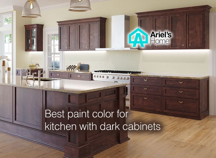 a large kitchen with wooden cabinets and white counter tops is featured in the article best paint color for kitchen with dark cabinets