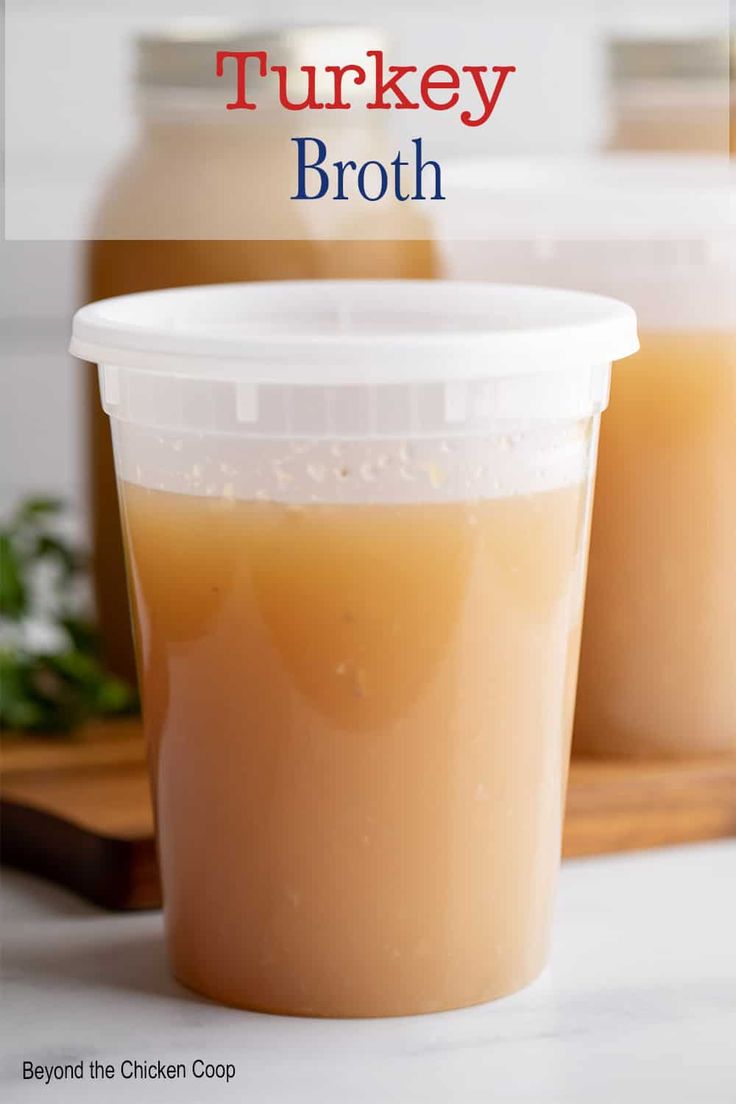 two plastic cups filled with turkey broth