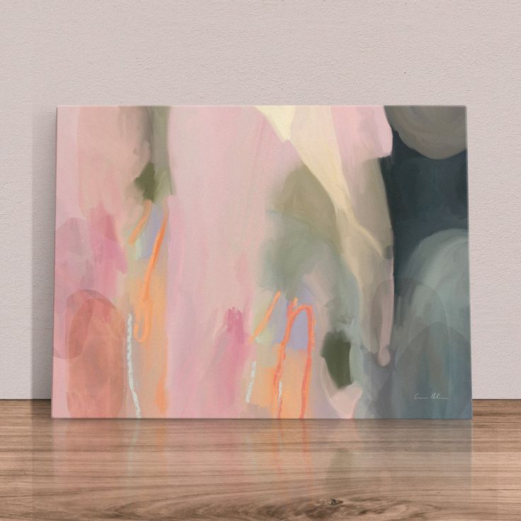 an abstract painting is displayed on the wall in front of a wood flooring area