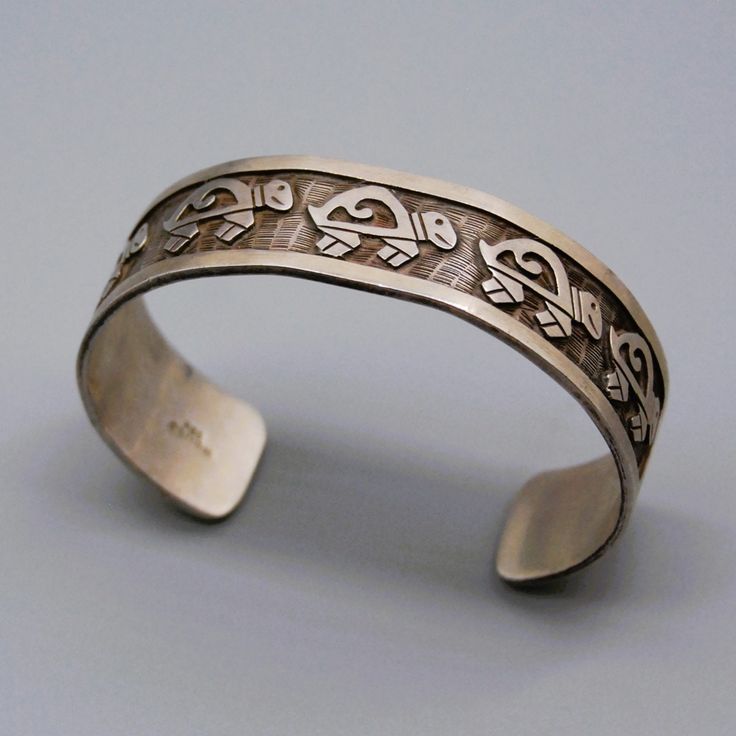 "Be noticeable with the jewelry you wear, buy unique Metal:Silver                                                                                   Metal Purity:.925 Hallmark:MEXICO Wearable Length ( inches ): 7.25\" including the gap of 1.25\" Width (inches/mm ):0.71 / 18.2 Weight ( gram ):39.5 Condition:Vintage" Symbolic Engraved Sterling Silver Cuff Bracelet, Handmade Cuff Jewelry For Anniversary, Sterling Silver Polished Cuff Jewelry, Unique Sterling Silver Cuff Jewelry, Silver Engraved Jewelry Cuff, Adjustable Etched Sterling Silver Bracelet For Anniversary, Engraved Silver Cuff Jewelry, Sterling Silver Cuff Jewelry In White Gold, Unique Sterling Silver Bracelet Stamped 925 As Gift