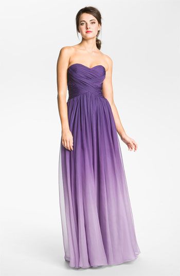 a woman in a strapless purple dress