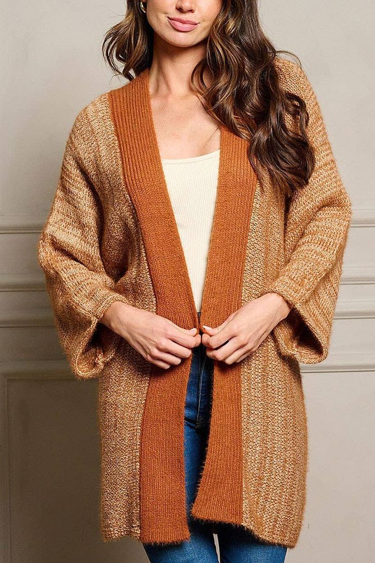 This rust colored chunky, open cardigan sweater is perfection for this Fall! 34% ACRYLIC 33% POLYESTER 33% COTTON. Casual Brown Sweater Coat For Fall, One Size Fall Sweater Coat For Layering, One Size Sweater Coat For Fall Layering, Brown Knitted Cardigan For Fall, Fall Cable Knit Brown Sweater Coat, Brown Long Cardigan For Winter, Long Brown Cardigan For Winter, One Size Knit Sweater Coat For Fall, Long Brown Winter Cardigan