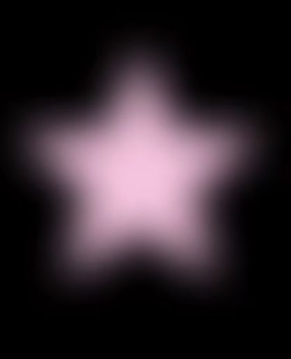 a blurry image of a pink star in the dark