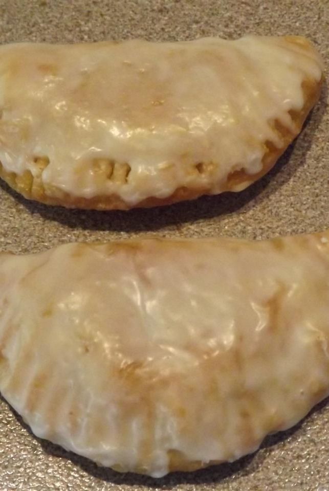 two uncooked pastries sitting on top of a counter