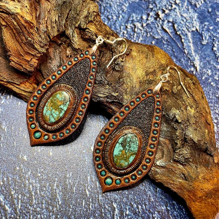 This pair of hand tooled and hand painted leather earrings with beautiful chrysocolla cabochons could become a nice addition to your Boho, hippie, casual, beach, Western clothes. Earrings are made with sterling silver hooks. This piece was MADE TO ORDER, thus in not available. If you would like me to make something for you please contact me for a custom order and we'll discuss the details. I've got plenty of different cabochons in stock, thus I believe we would find something just for you. The p Hand Tooled Teardrop Bohemian Earrings, Handmade Leather Turquoise Earrings, Bohemian Hand Tooled Teardrop Earrings, Handmade Turquoise Leather Earrings, Handmade Leather Earrings In Turquoise, Bohemian Hand-tooled Leather Earrings, Bohemian Teardrop Hand Tooled Earrings, Bohemian Turquoise Leather Earrings, Rustic Hand Tooled Leather Jewelry